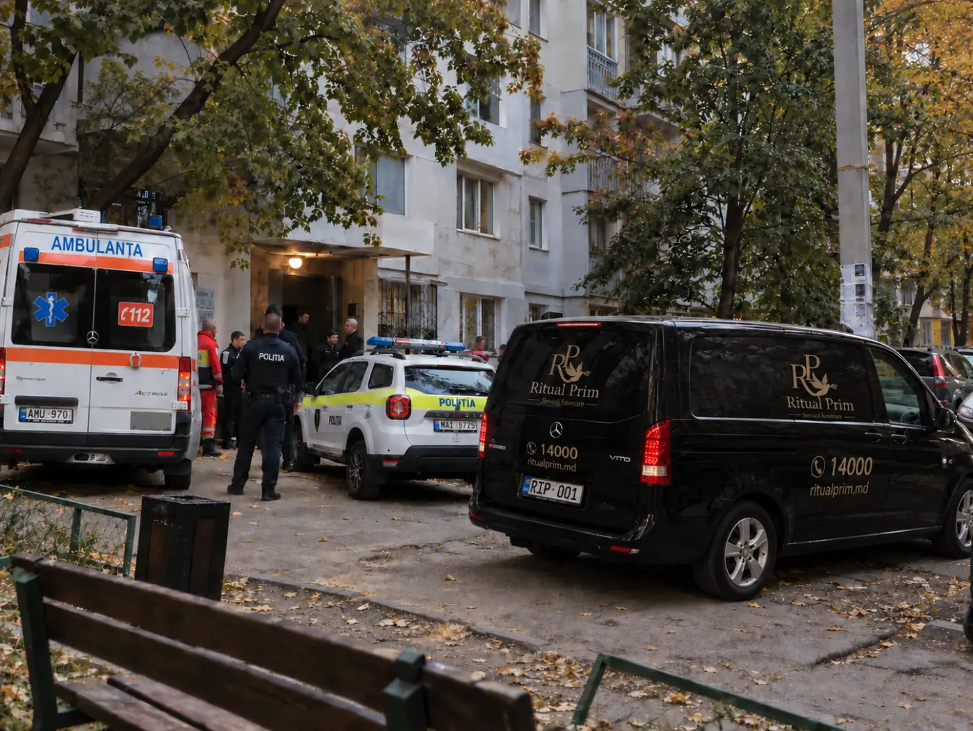 An ambulance, the police and a Ritual Prim vehicle at the entrance to a block of flats in Chișinău
