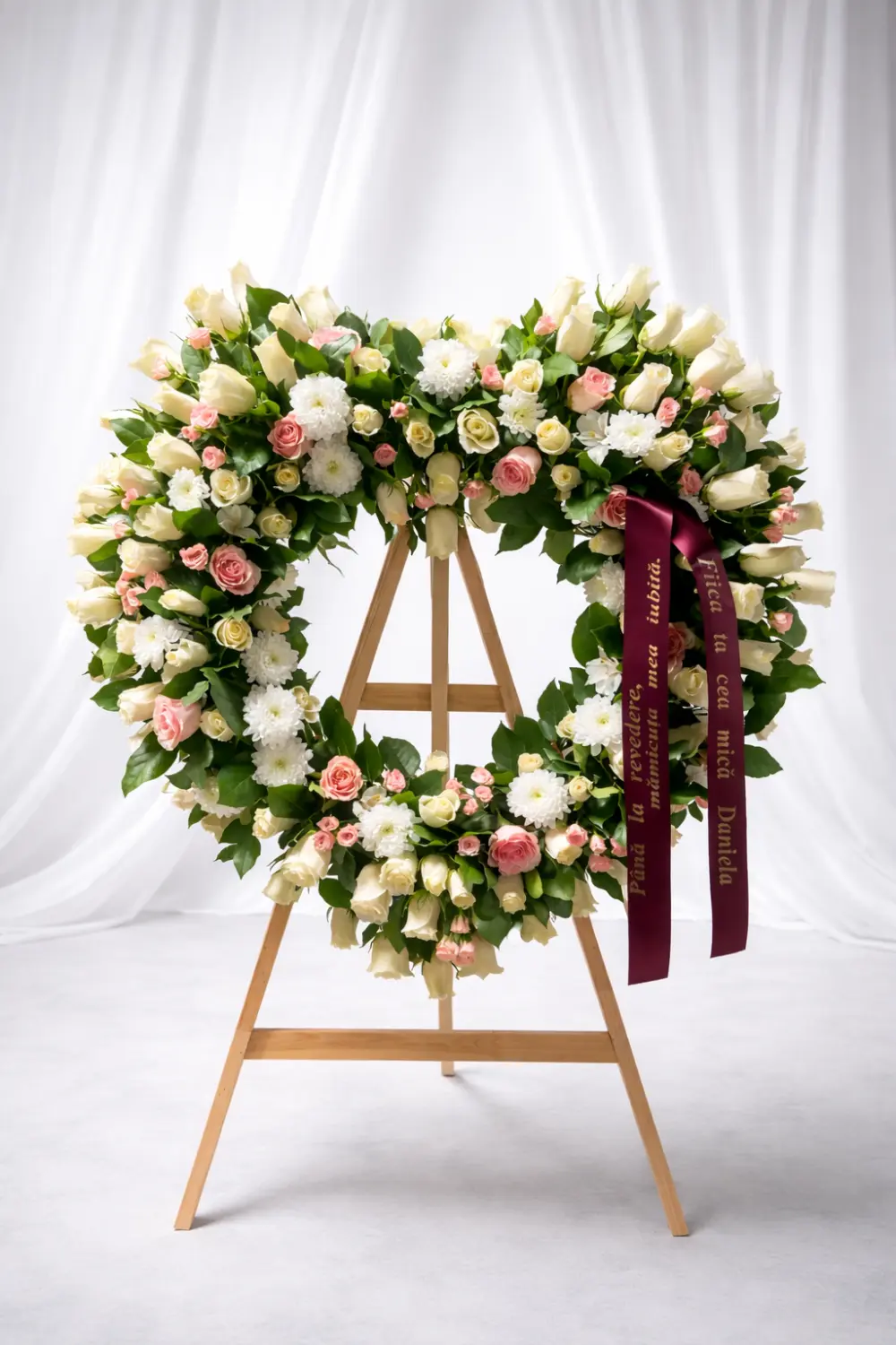 Heart wreath of cream and pink roses with chrysanthemums