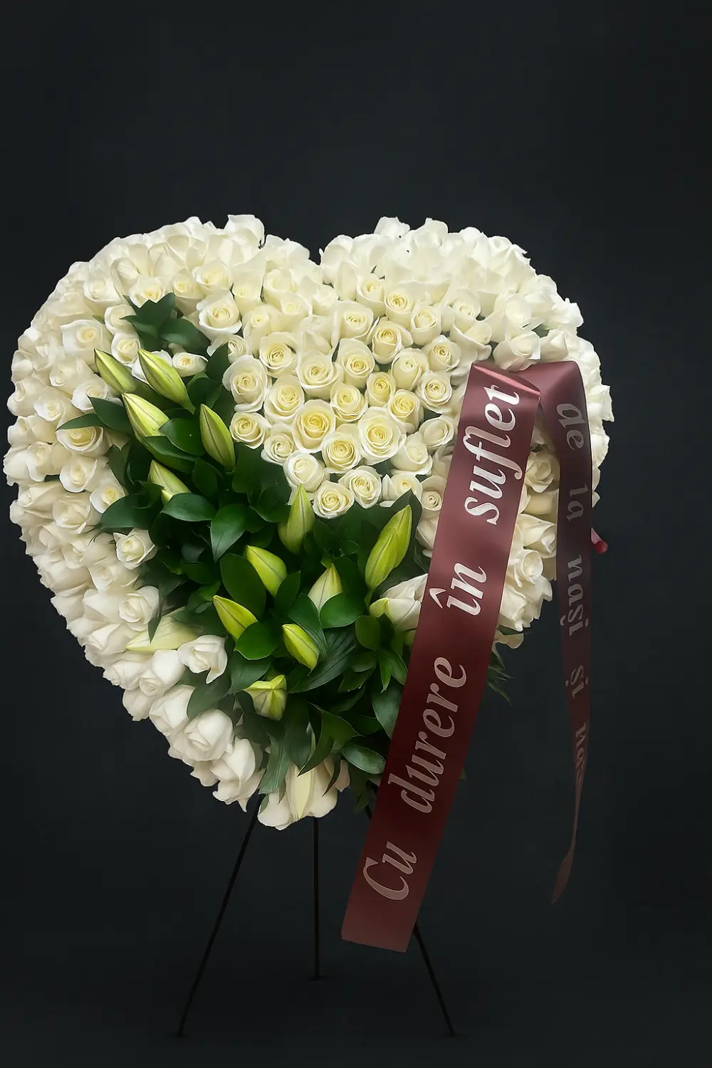 Heart wreath of white roses with lily buds